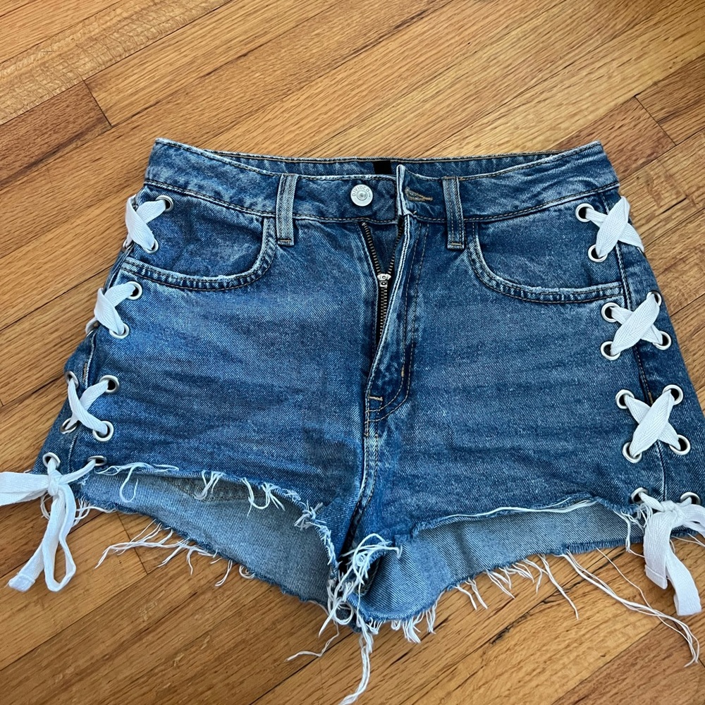 Jean shorts with white ties on the side
